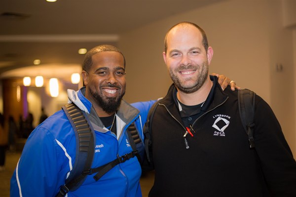 DECA Advisors Smiling at a Conference